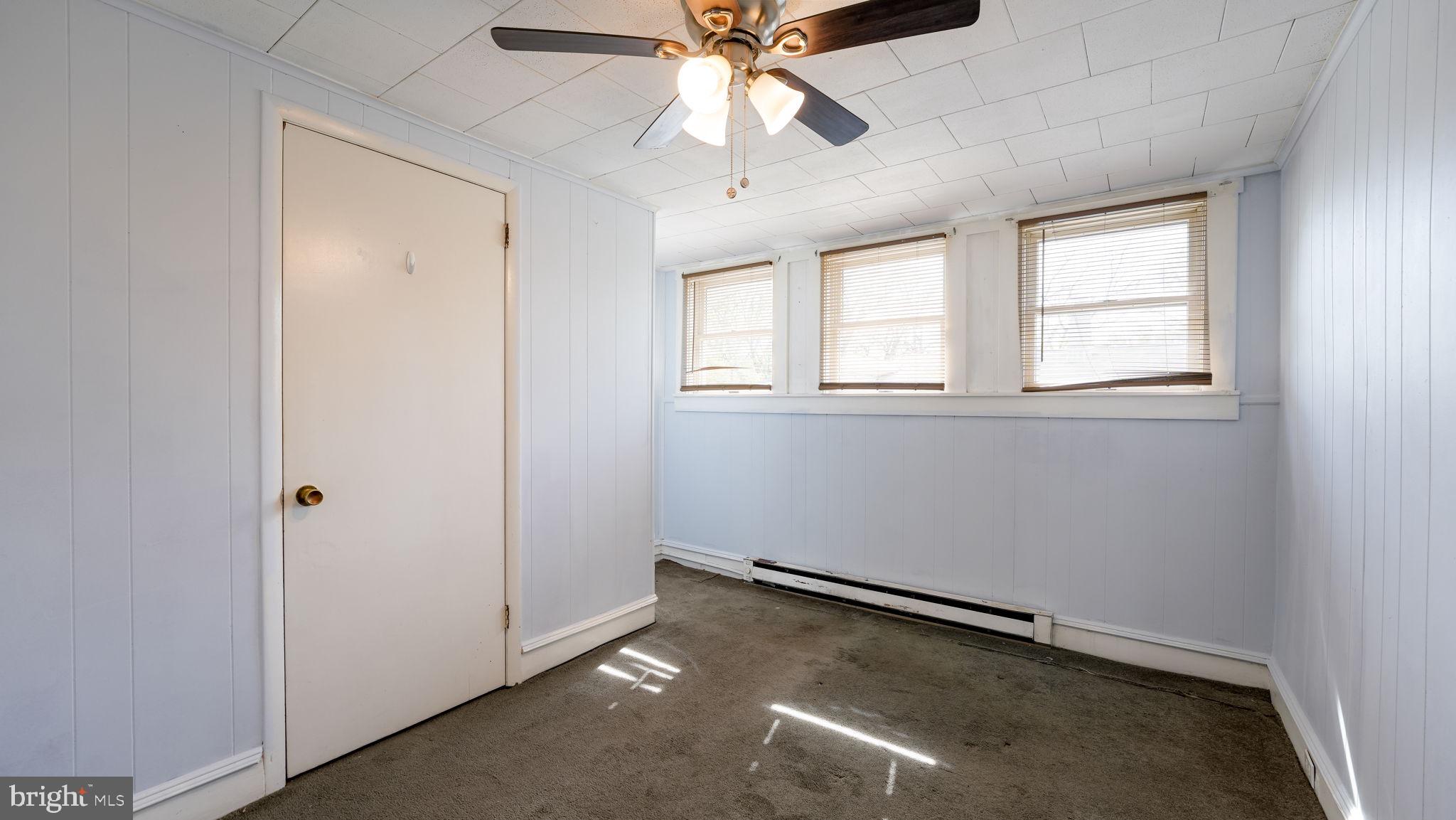 165 West Street Souderton, PA 18964 - Photo 23 of 31 an empty room with windows and fan