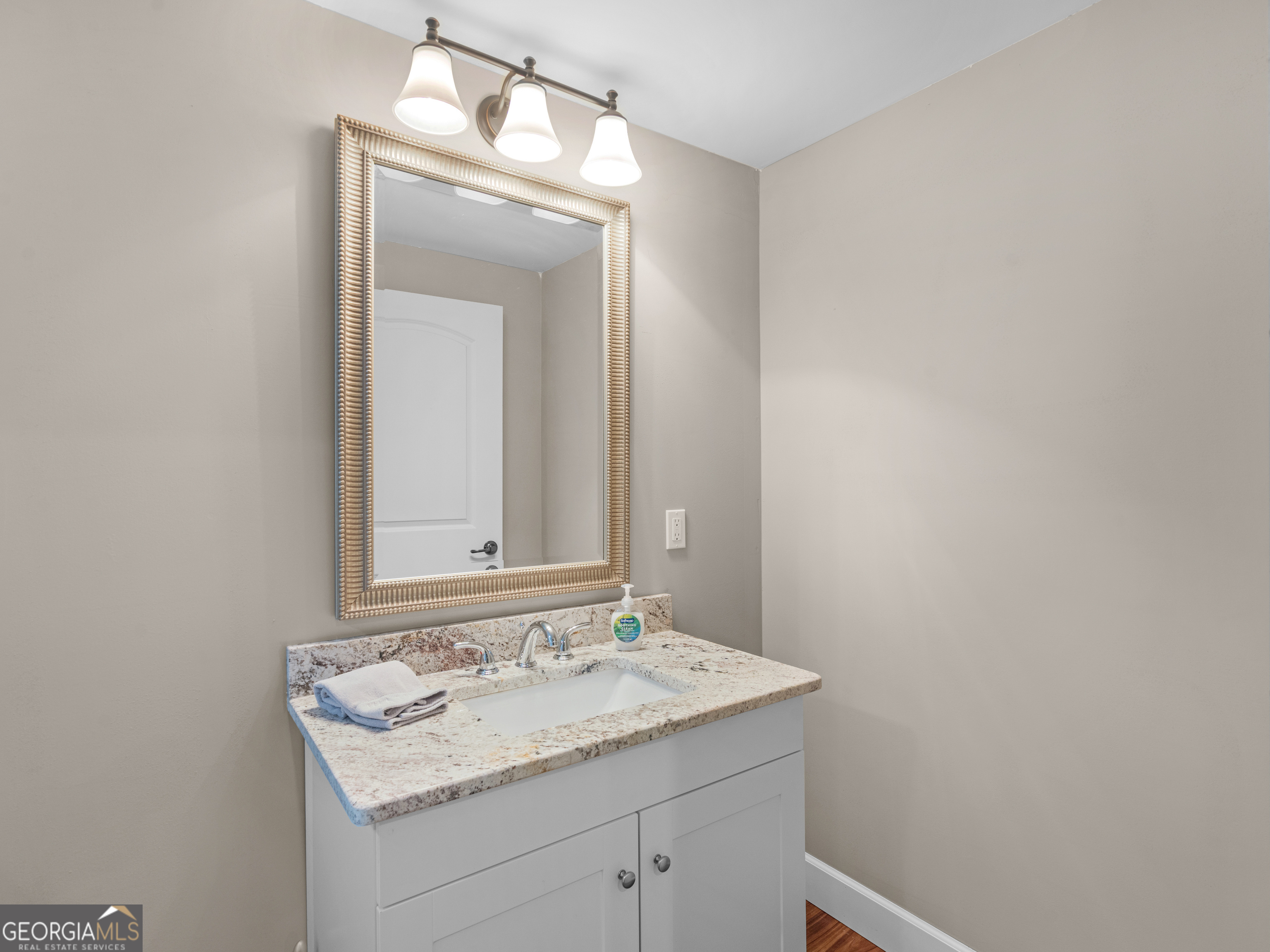 221 Hummingbird Court Hampton, GA 30228 - Photo 56 of 77 a bathroom with a sink and a mirror