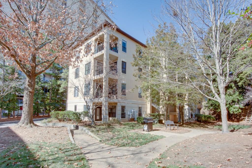 a view of a building with a yard