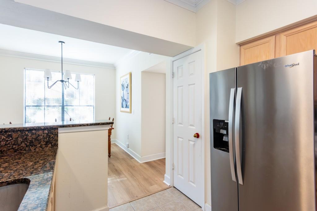 3777 Peachtree Road Northeast, Unit 1007 Brookhaven, GA 30319 - Photo 13 of 39 a kitchen with stainless steel appliances granite countertop a refrigerator and a sink