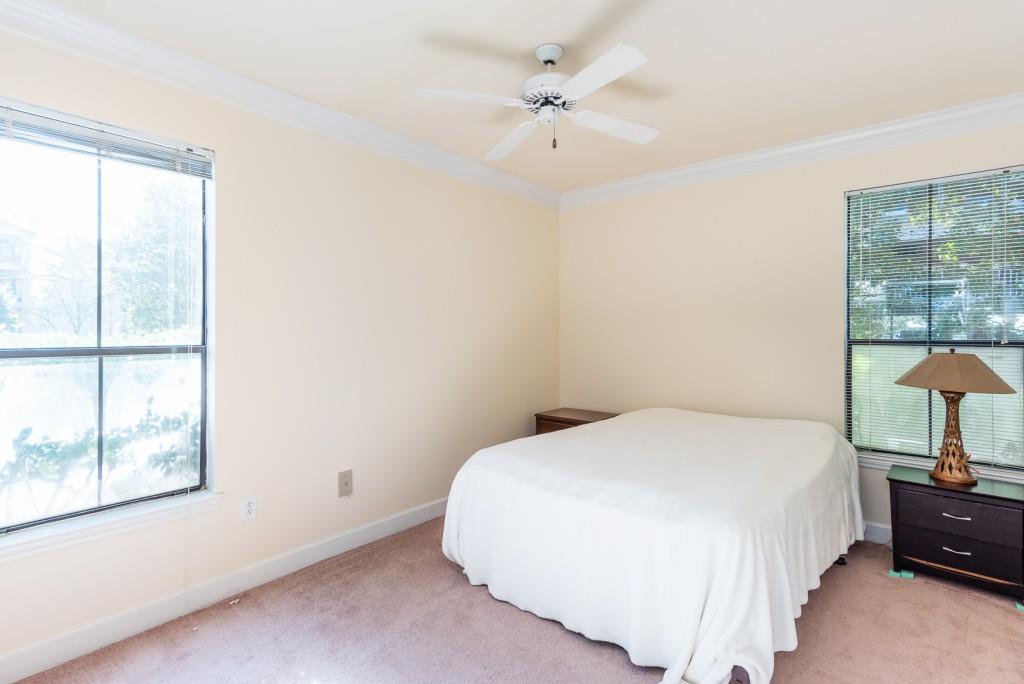3777 Peachtree Road Northeast, Unit 1007 Brookhaven, GA 30319 - Photo 14 of 39 a bedroom with a bed and a window