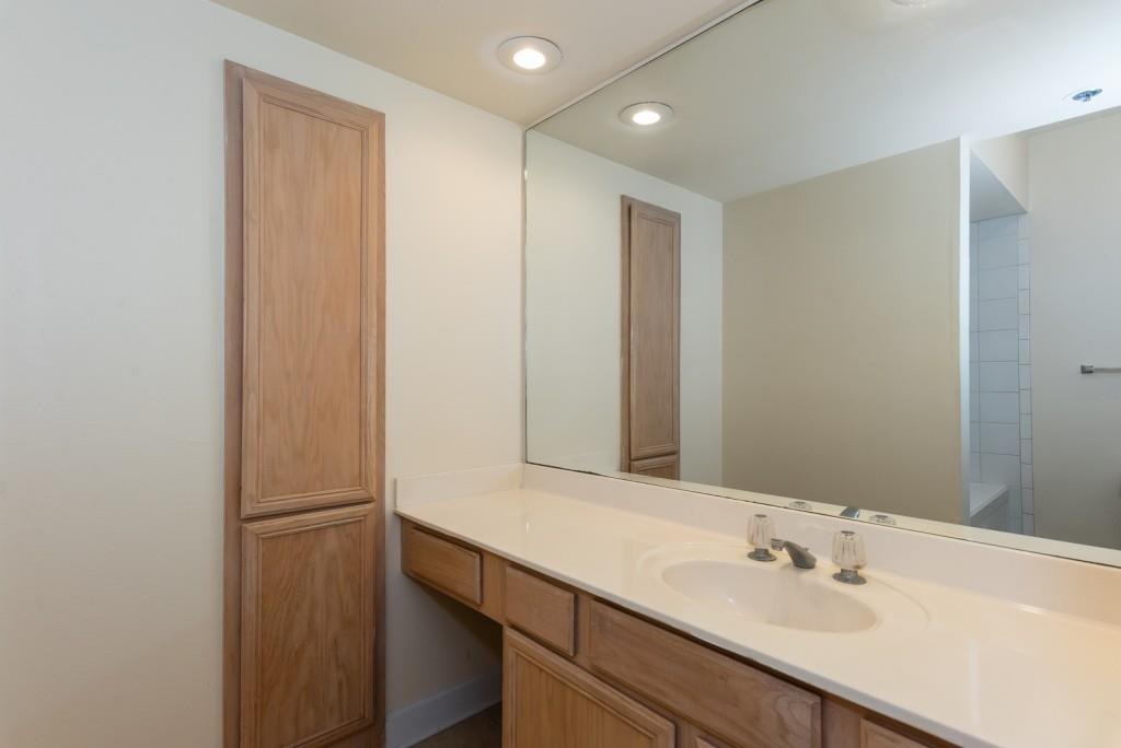 3777 Peachtree Road Northeast, Unit 1007 Brookhaven, GA 30319 - Photo 18 of 39 a bathroom with a sink and a mirror