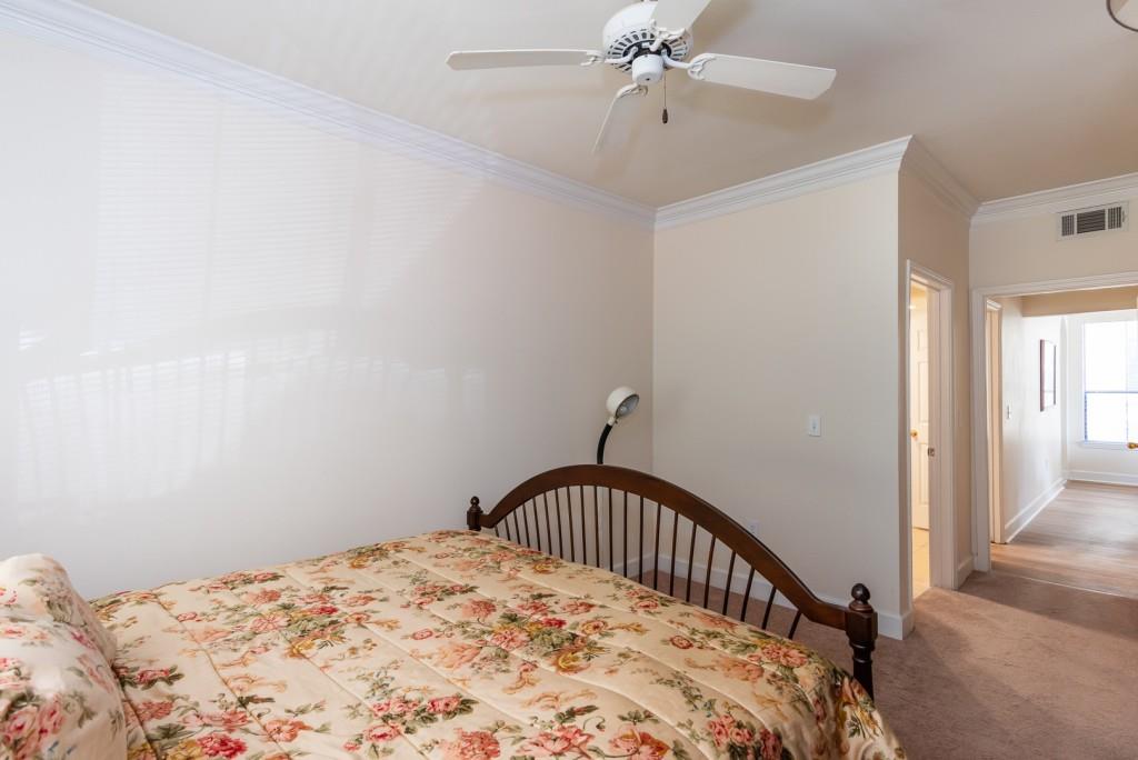 3777 Peachtree Road Northeast, Unit 1007 Brookhaven, GA 30319 - Photo 21 of 39 a bedroom with a bed and a window