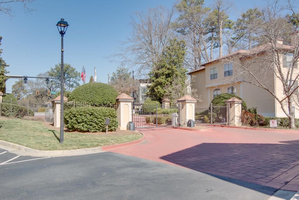 3777 Peachtree Road Northeast, Unit 1007 Brookhaven, GA 30319 - Photo 27 of 39 a view of a house with a yard and potted plants