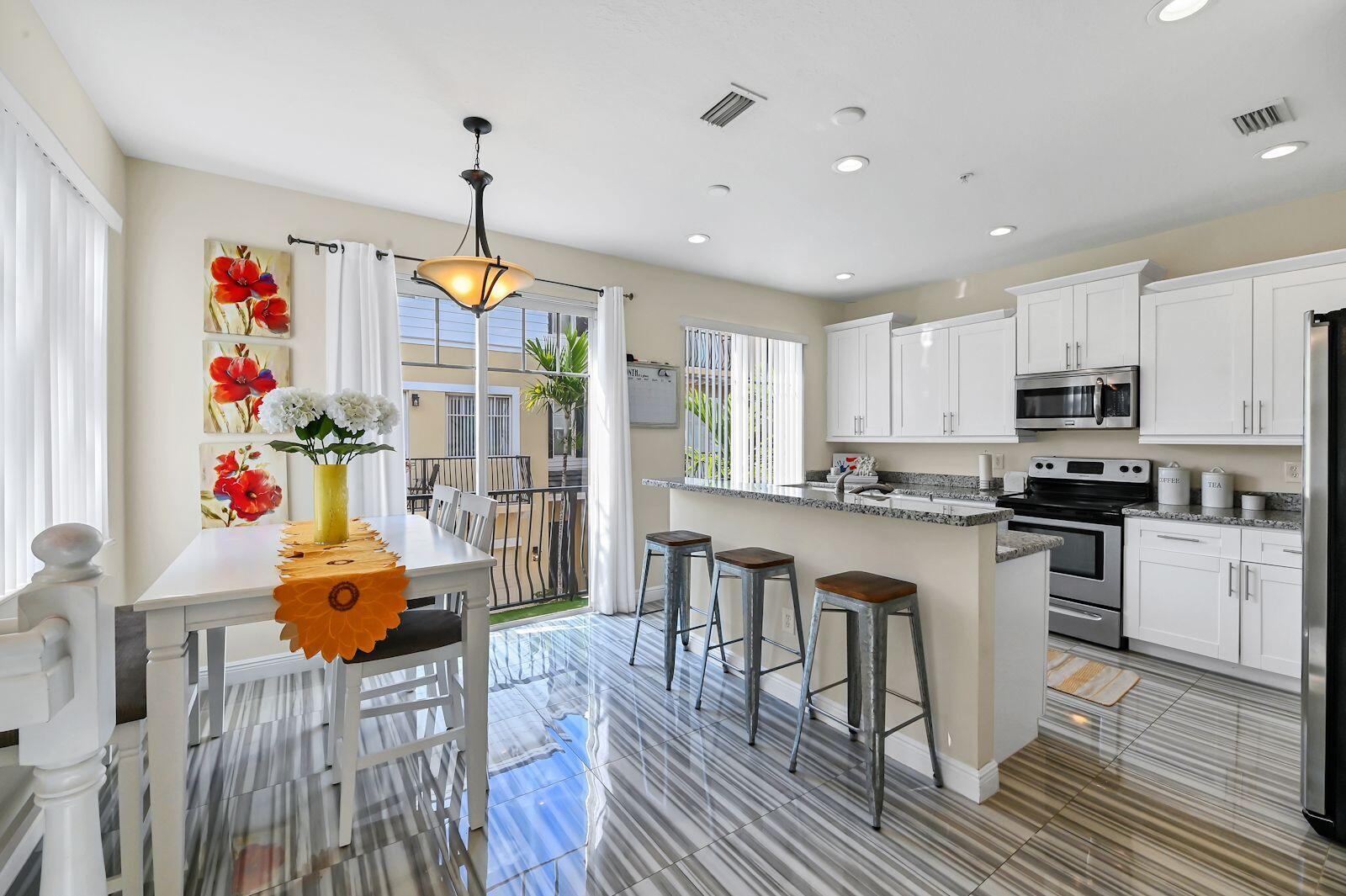3841 Northwest 5th Terrace Boca Raton, FL 33431 - Photo 7 of 16 Kitchen with Private Balcony