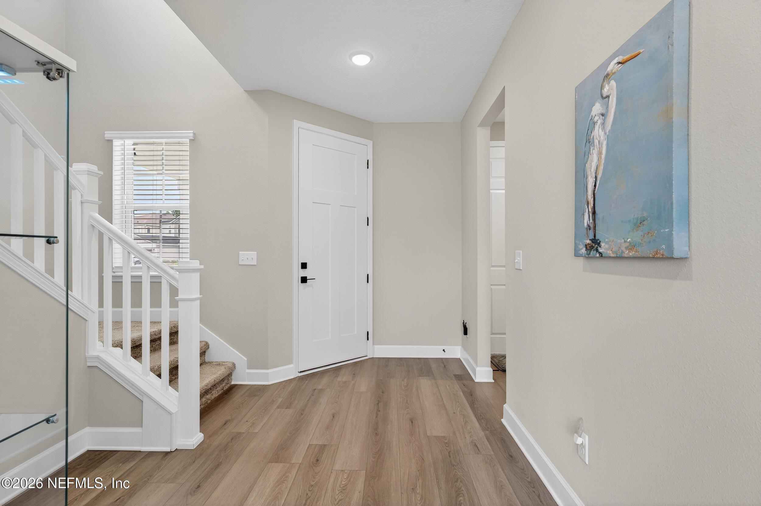57 Cedar Elm Way St. Augustine, FL 32092 - Photo 6 of 65 a view of an entryway with wooden floor