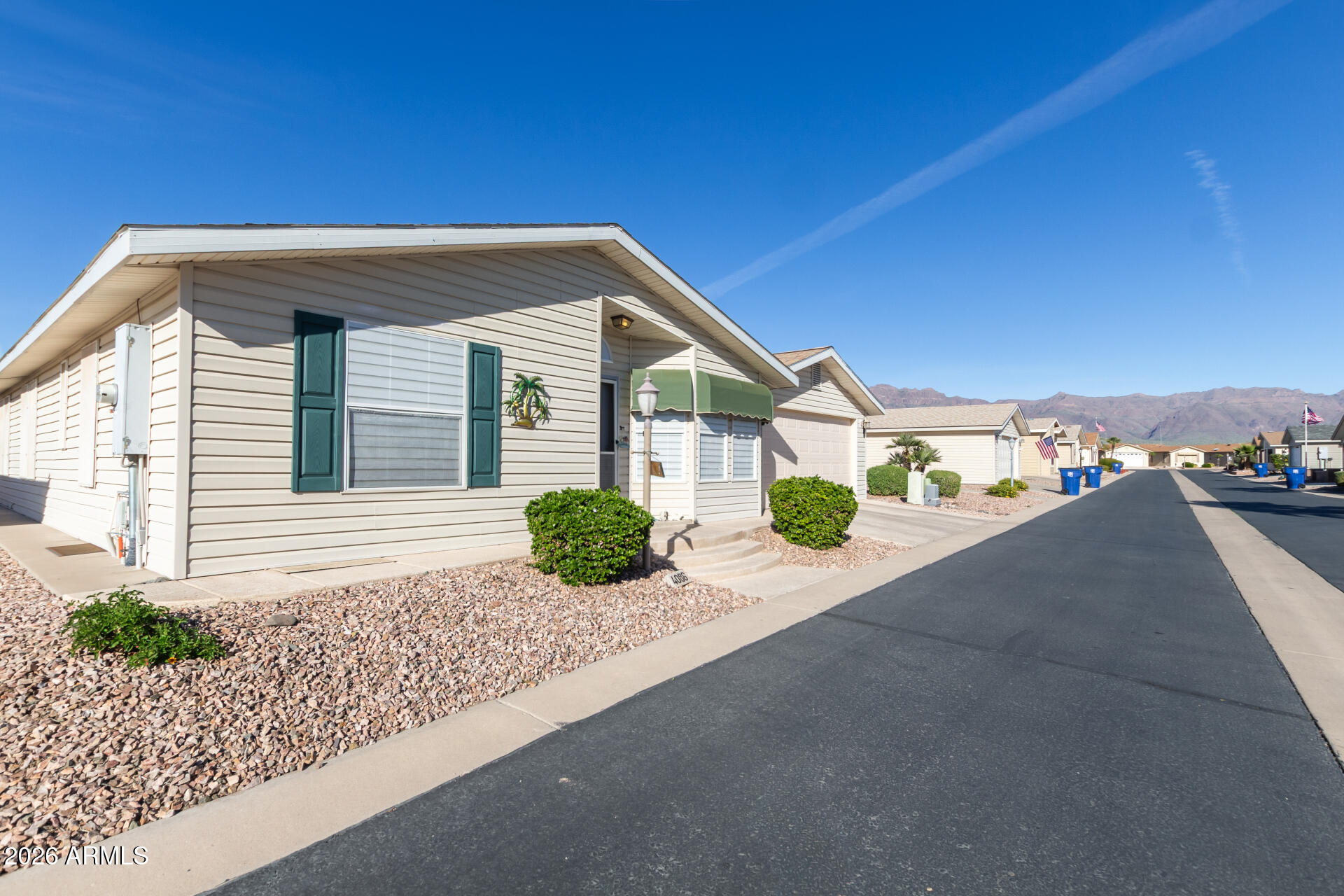 3301 South Goldfield Road, Unit 4086 Apache Junction, AZ 85119 - Photo 31 of 41 a view of a house with a street