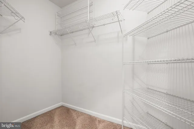 a bathroom with a granite countertop sink mirror and double
