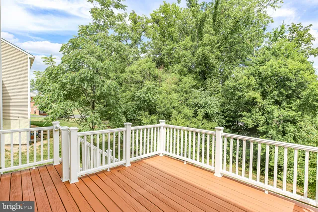 a view of wooden deck and a yard