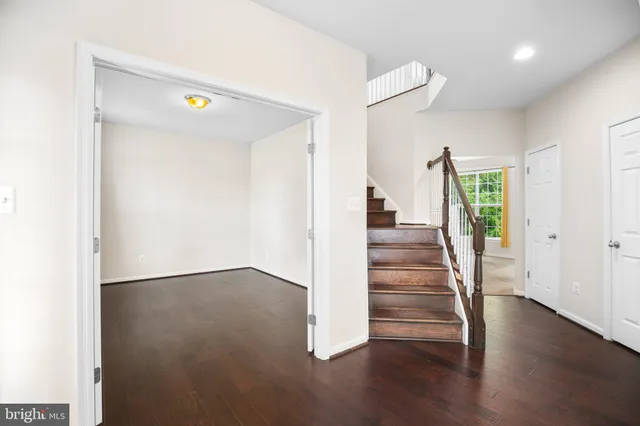 a view of an entryway with wooden floor
