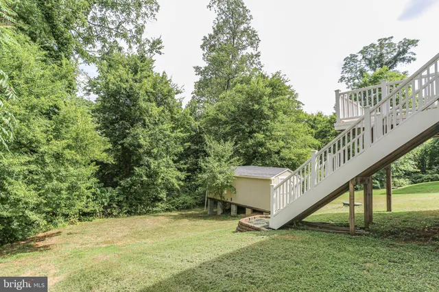 a house view with a sitting space and garden