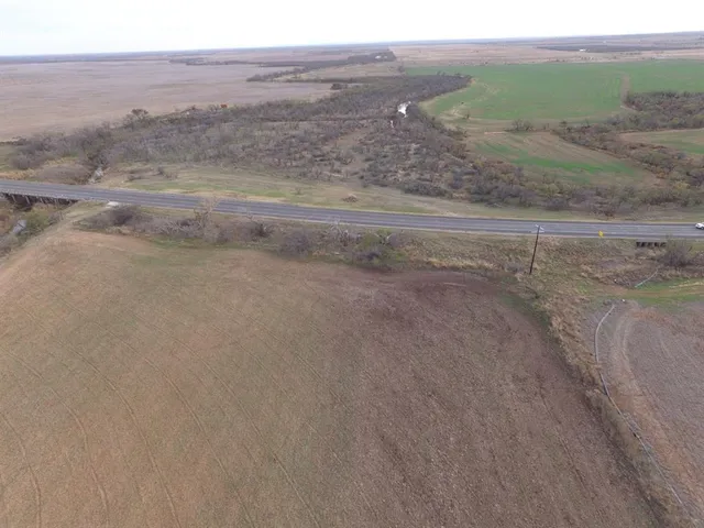 a view of a field with beach