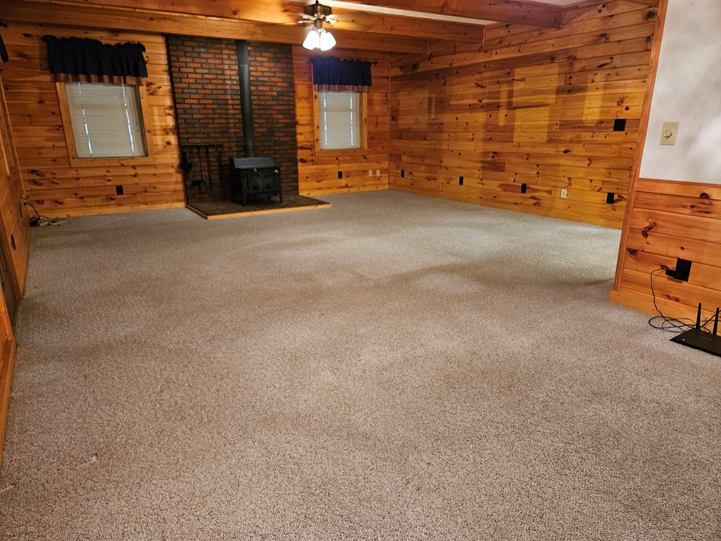 1705 Homer Wright Road Talking Rock, GA 30175 - Photo 18 of 98 a view of an empty room with a fireplace