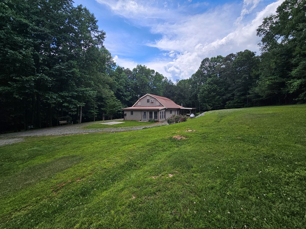 1705 Homer Wright Road Talking Rock, GA 30175 - Photo 2 of 98 a view of a house with a yard