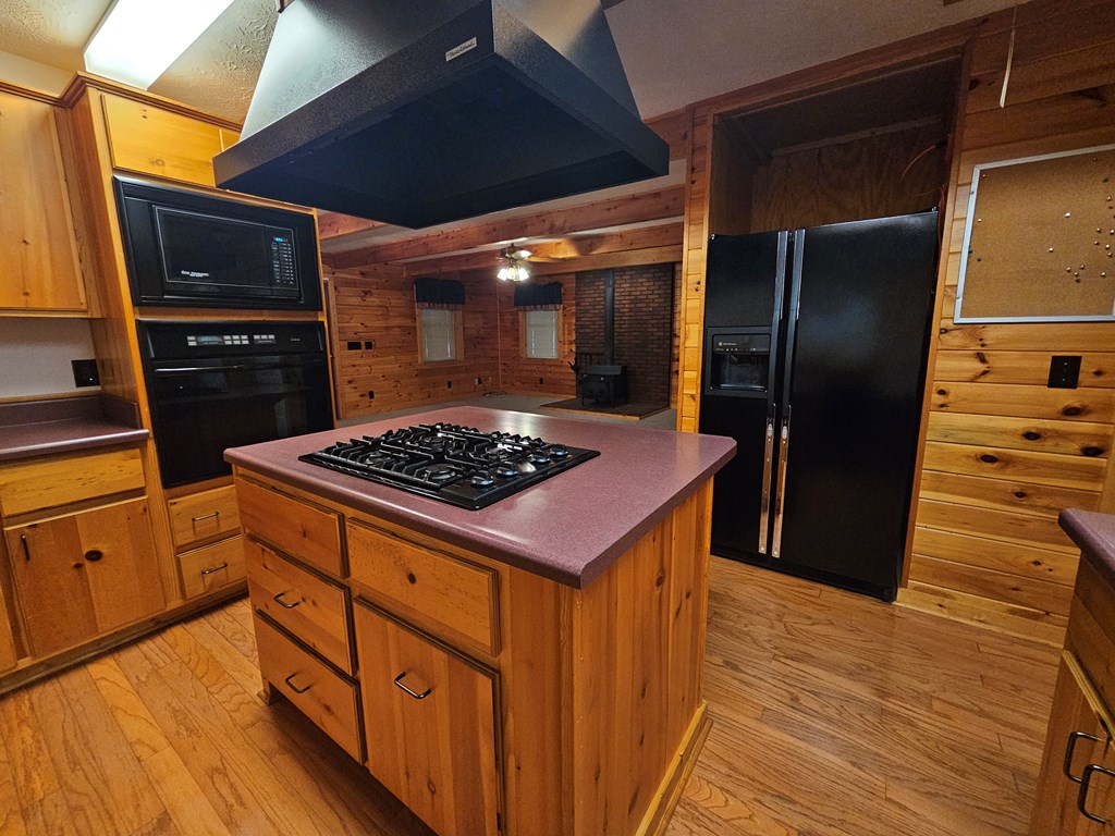 1705 Homer Wright Road Talking Rock, GA 30175 - Photo 21 of 98 a kitchen with stainless steel appliances granite countertop a stove a refrigerator and a microwave