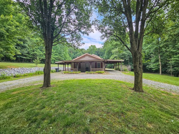 1705 Homer Wright Road Talking Rock, GA 30175 - Photo 30 of 98 a house with green field in front of it