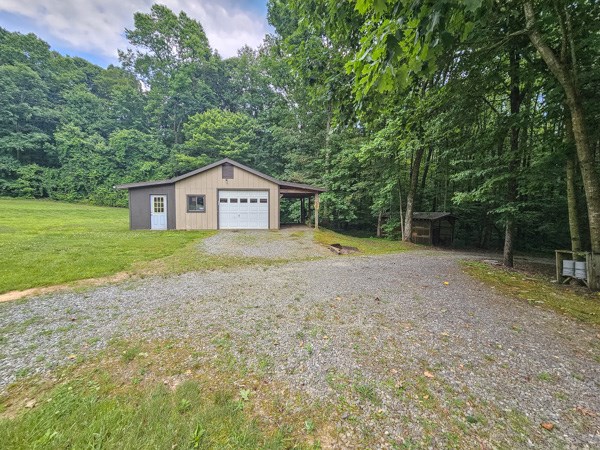 1705 Homer Wright Road Talking Rock, GA 30175 - Photo 36 of 98 a house with a tree in front of it