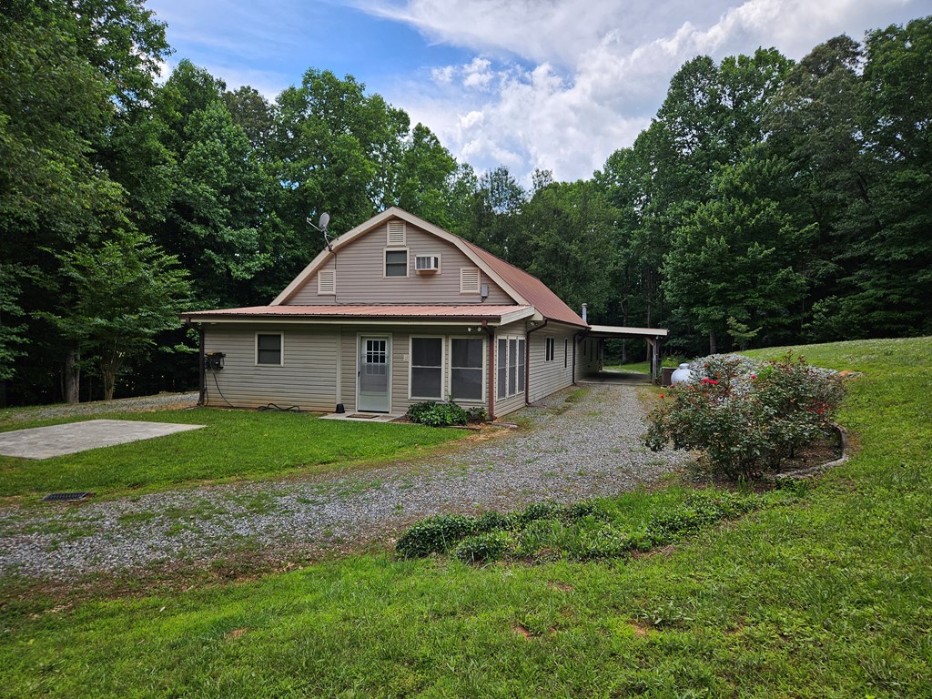 1705 Homer Wright Road Talking Rock, GA 30175 - Photo 4 of 98 a front view of a house with a yard