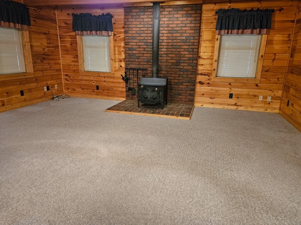 1705 Homer Wright Road Talking Rock, GA 30175 - Photo 53 of 98 a view of an empty room with a fireplace