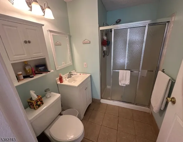 a white toilet sitting next to a bathroom sink