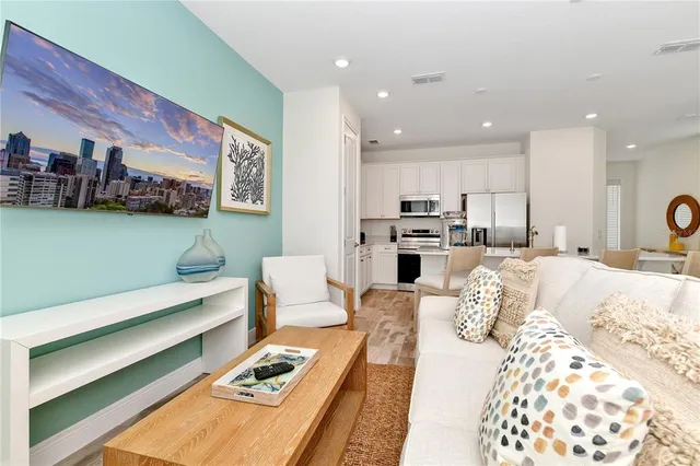 a large bedroom with a bed and furniture