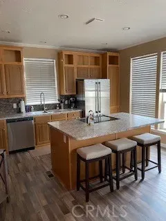 a kitchen with a stove a sink and a refrigerator