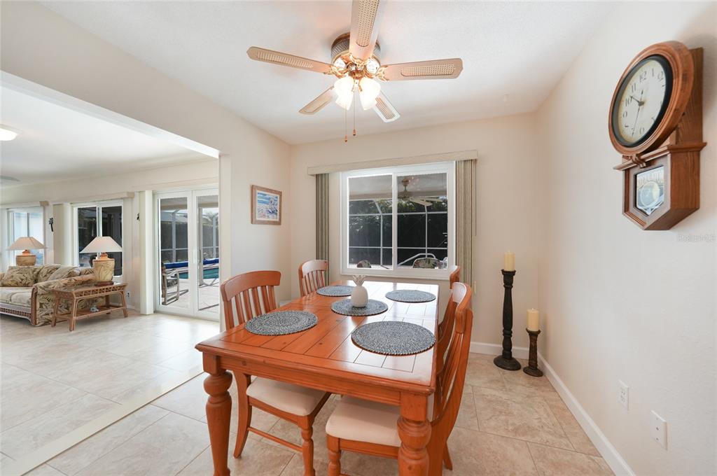 18097 Brazil Avenue Port Charlotte, FL 33948 - Photo 13 of 37 a dining room with furniture and window
