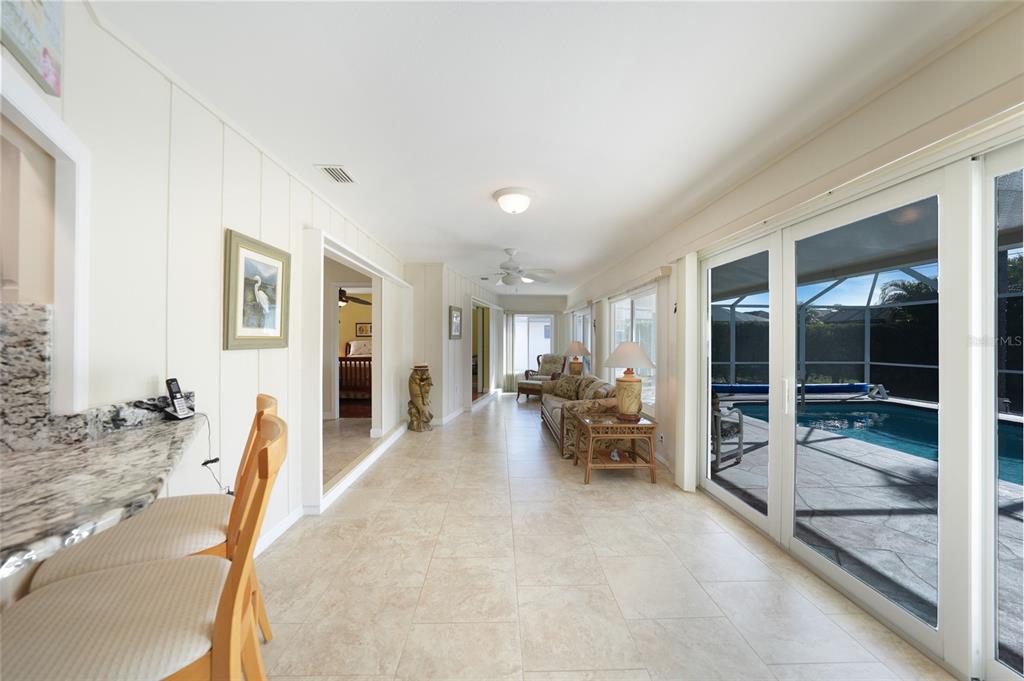 18097 Brazil Avenue Port Charlotte, FL 33948 - Photo 15 of 37 a view of a livingroom with furniture and floor to ceiling window