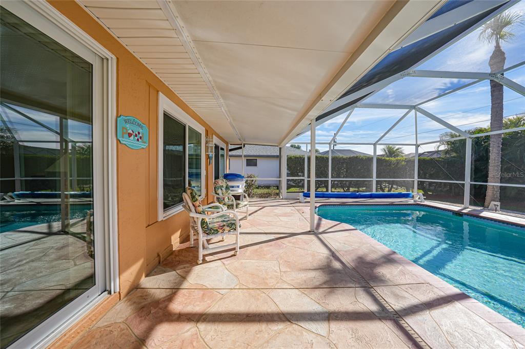 18097 Brazil Avenue Port Charlotte, FL 33948 - Photo 26 of 37 a view of swimming pool with seating space and furniture