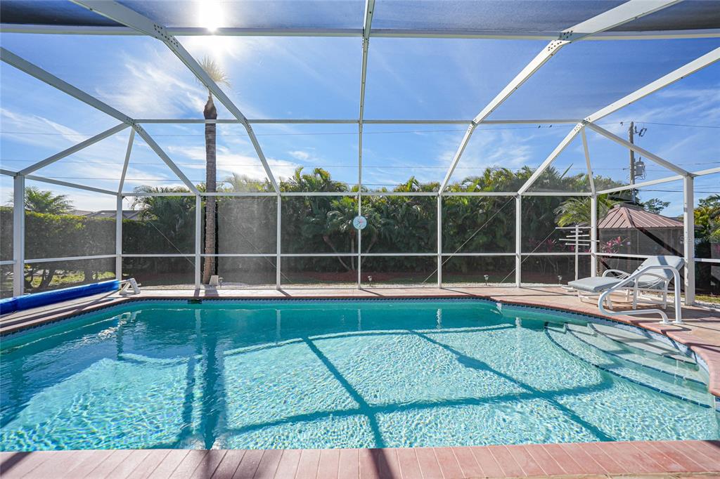 18097 Brazil Avenue Port Charlotte, FL 33948 - Photo 29 of 37 a view of a backyard with swimming pool