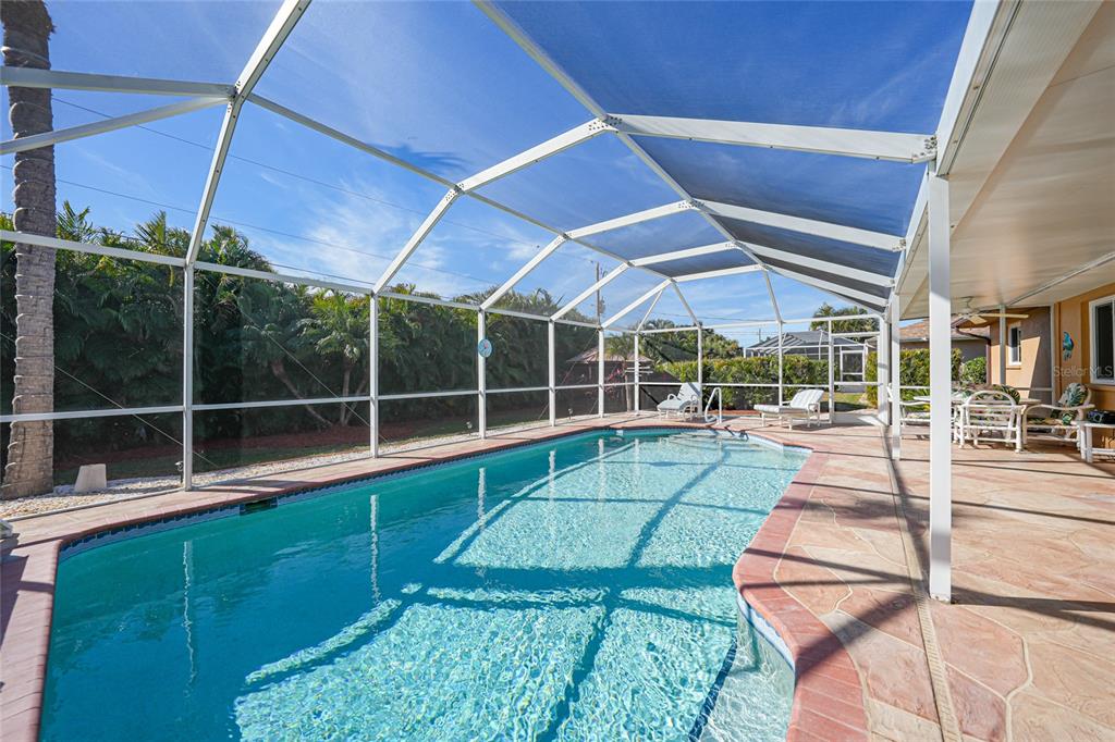 18097 Brazil Avenue Port Charlotte, FL 33948 - Photo 30 of 37 a view of yard with a large pool table and chairs