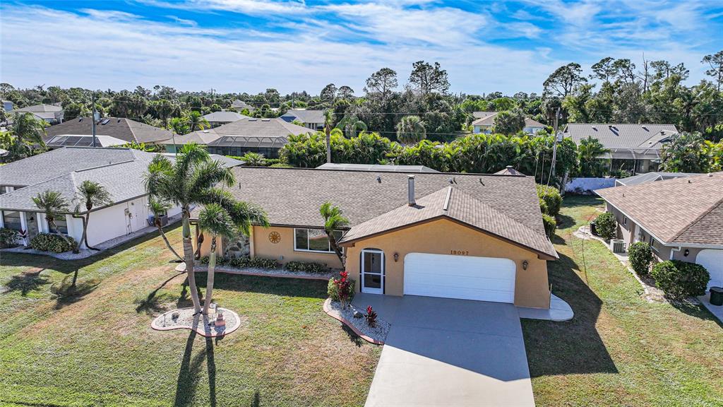 18097 Brazil Avenue Port Charlotte, FL 33948 - Photo 3 of 37 an aerial view of a house with a yard