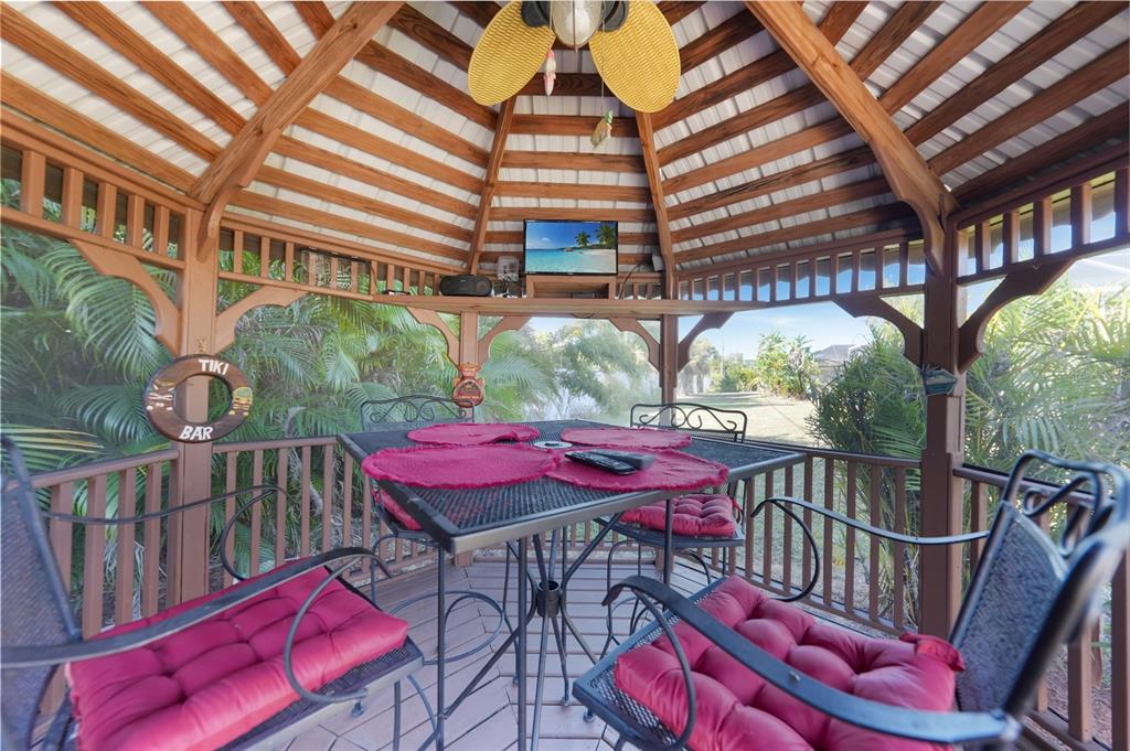 18097 Brazil Avenue Port Charlotte, FL 33948 - Photo 33 of 37 a view of a cafe with a table and chairs