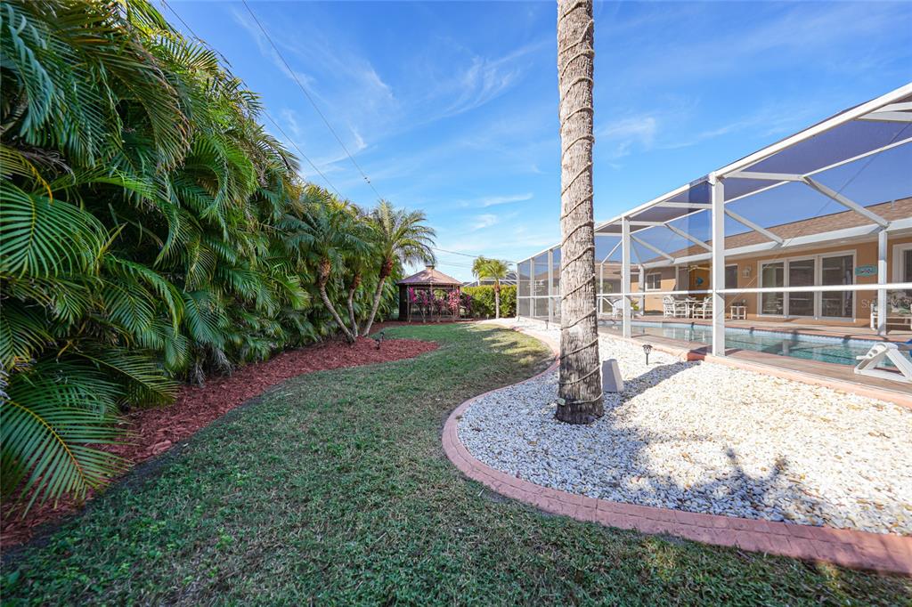 18097 Brazil Avenue Port Charlotte, FL 33948 - Photo 34 of 37 a house view with a garden space