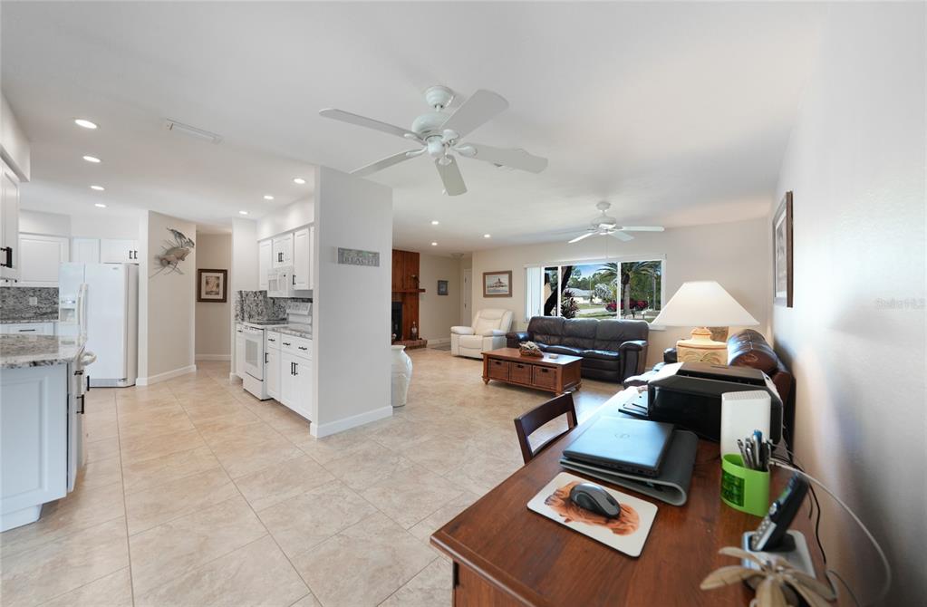 18097 Brazil Avenue Port Charlotte, FL 33948 - Photo 8 of 37 a living room with furniture and kitchen view