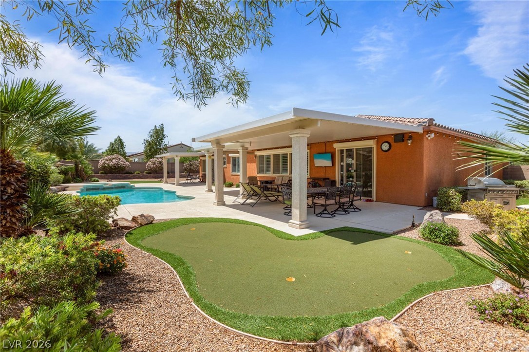 8431 Durango Ranch Court Las Vegas, NV 89113 - Photo 39 of 49 This private outdoor oasis offers a refreshing pool, inviting patio, and a putting green.