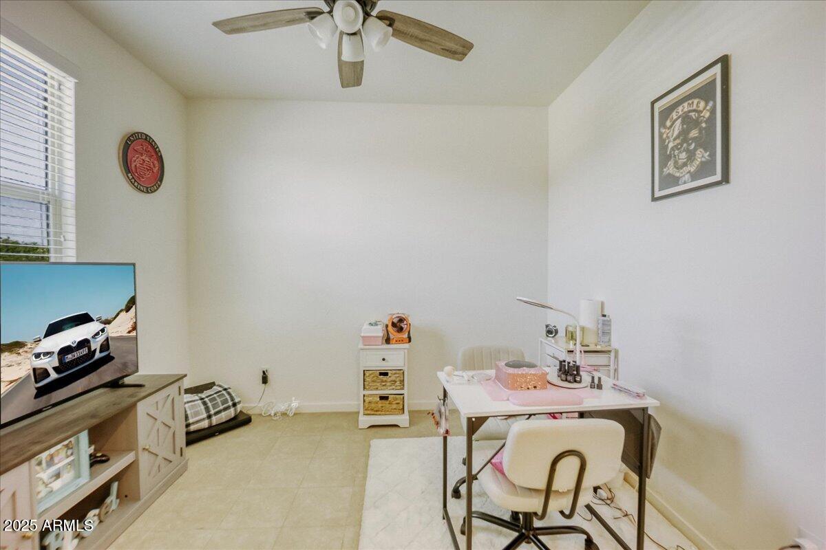 9825 West Trumbull Road Tolleson, AZ 85353 - Photo 3 of 19 a room with a table and workspace