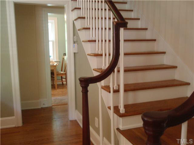 304 Brooks Avenue Raleigh, NC 27607 - Photo 8 of 14 Charming staircase and back hall to kitchen, bath and bedroom Staircase
