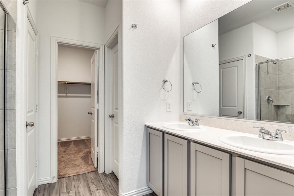 134 Blair Drive Fate, TX 75189 - Photo 15 of 25 a bathroom with a sink and a mirror
