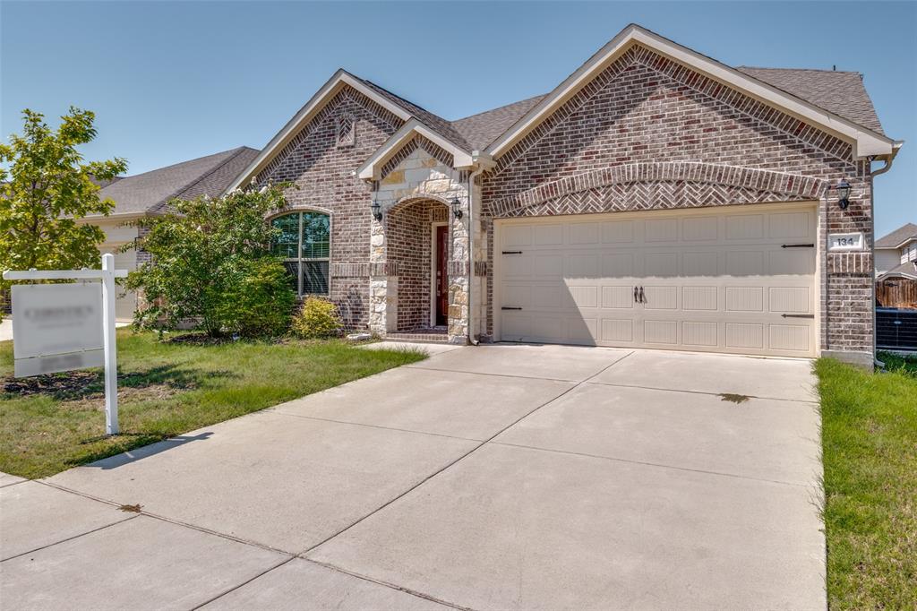 134 Blair Drive Fate, TX 75189 - Photo 2 of 25 a front view of a house with garden