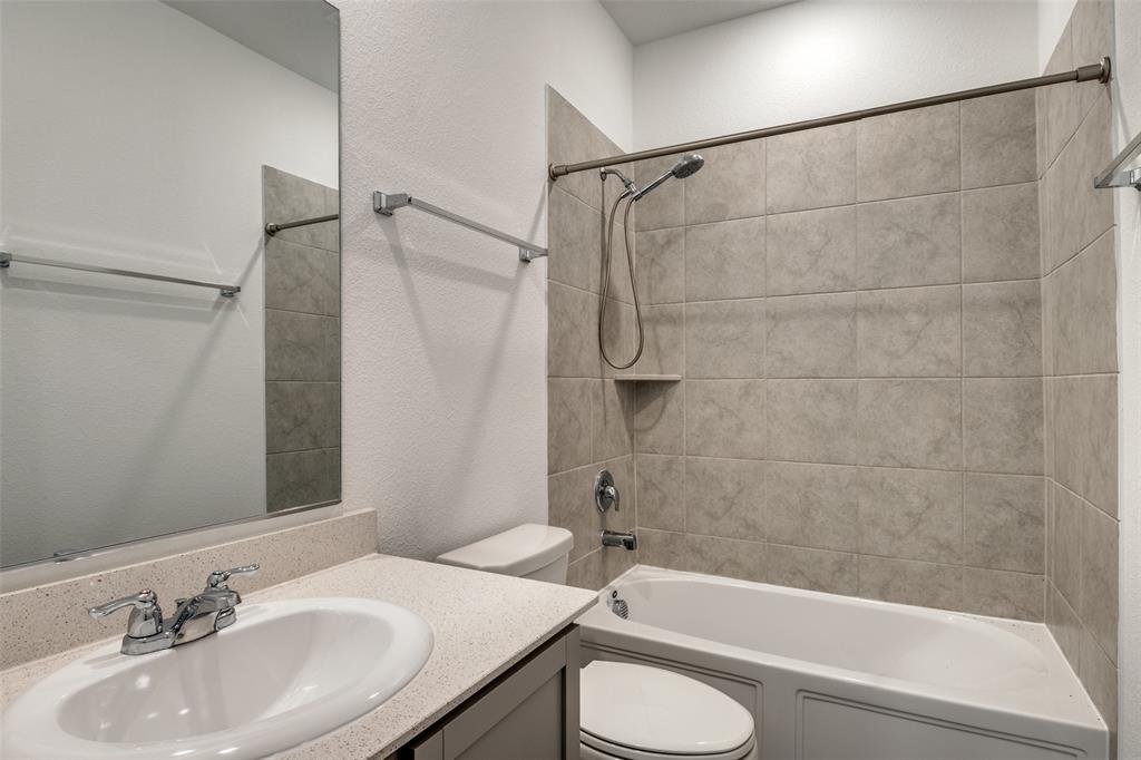 134 Blair Drive Fate, TX 75189 - Photo 21 of 25 a bathroom with a sink toilet and shower