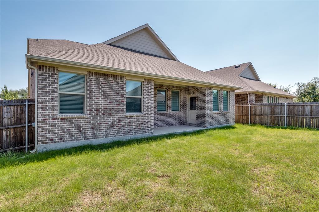 134 Blair Drive Fate, TX 75189 - Photo 24 of 25 a front view of a house with garden