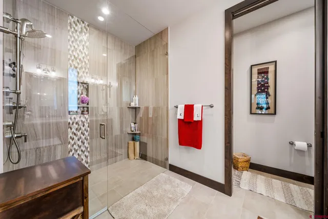 a view of a bathroom with a shower and a sink
