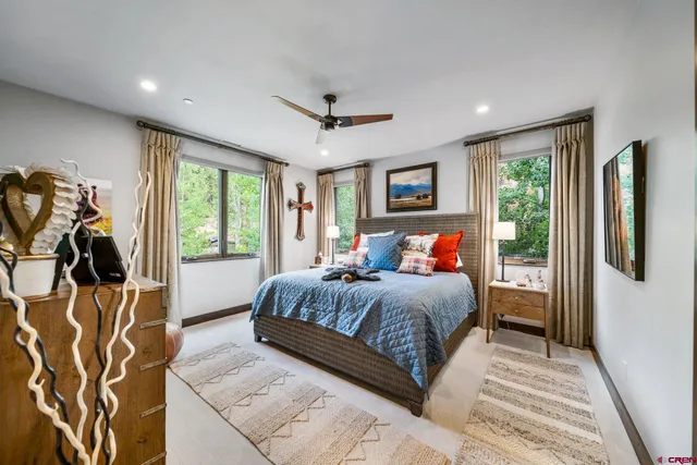 a bedroom with a large bed and a window