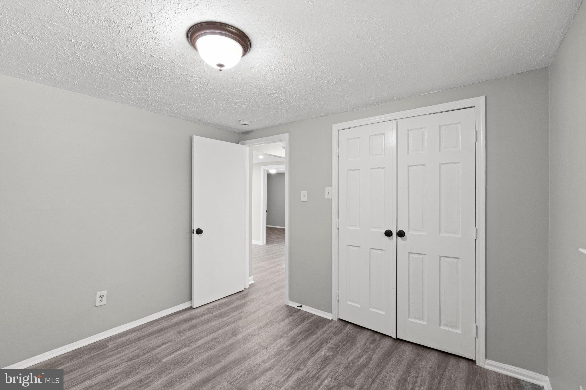8405 Shirley Road Spotsylvania, VA 22551 - Photo 21 of 42 a view of room with wooden floor