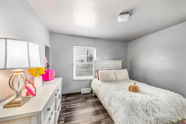 a bed room with a bed and a couch