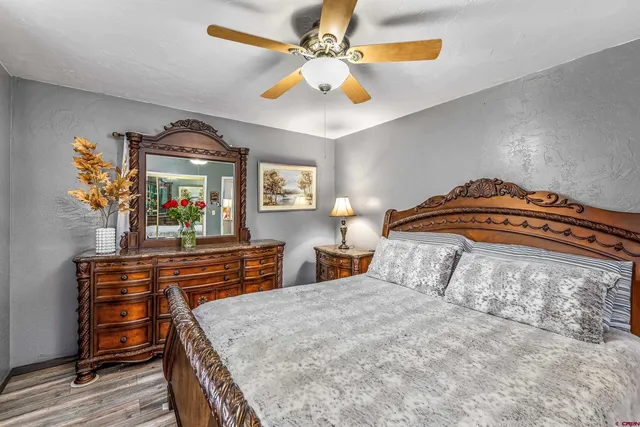 a bedroom with a bed and a dresser