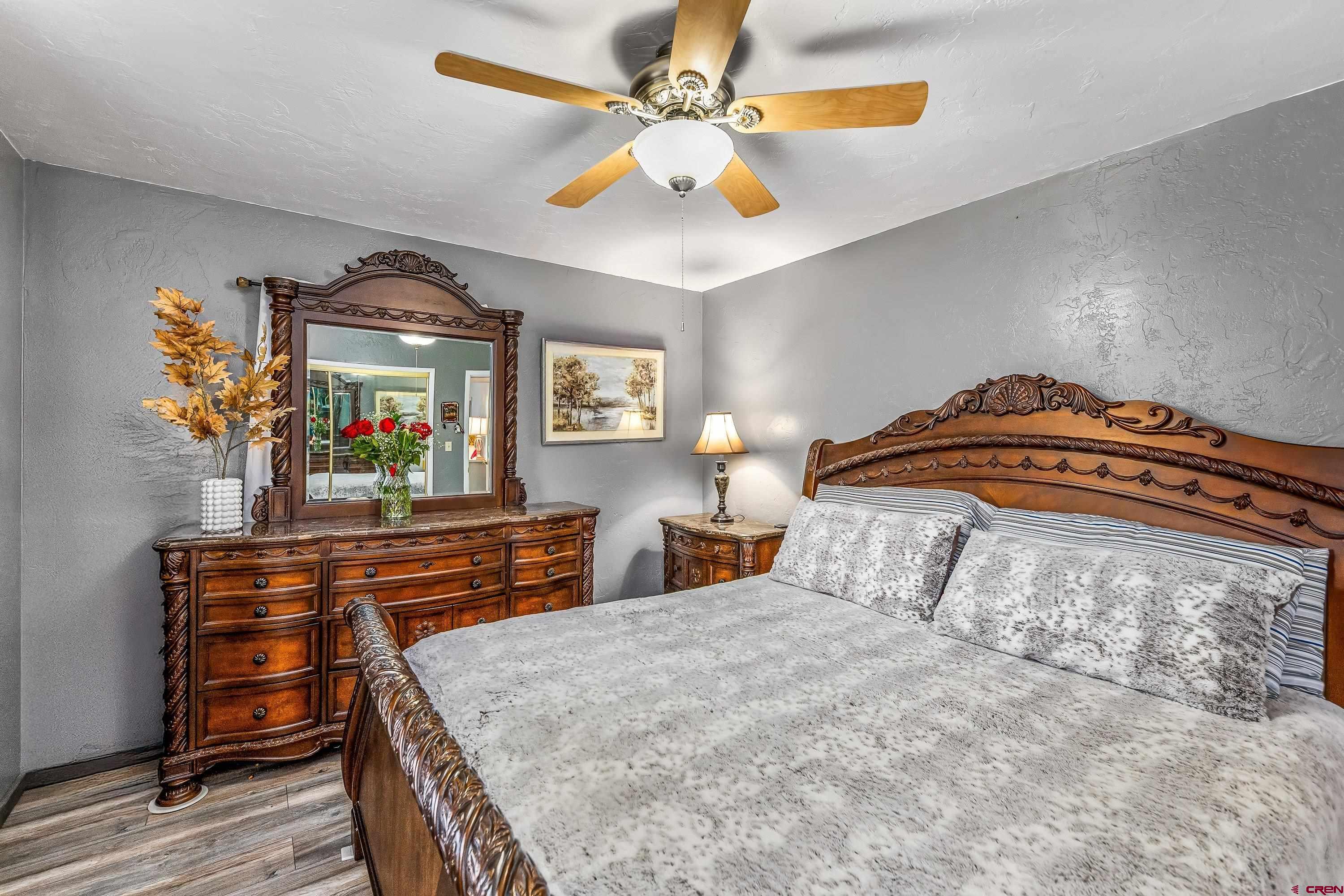 645 Leon Street Delta, CO 81416 - Photo 16 of 28 a bedroom with a bed and a dresser