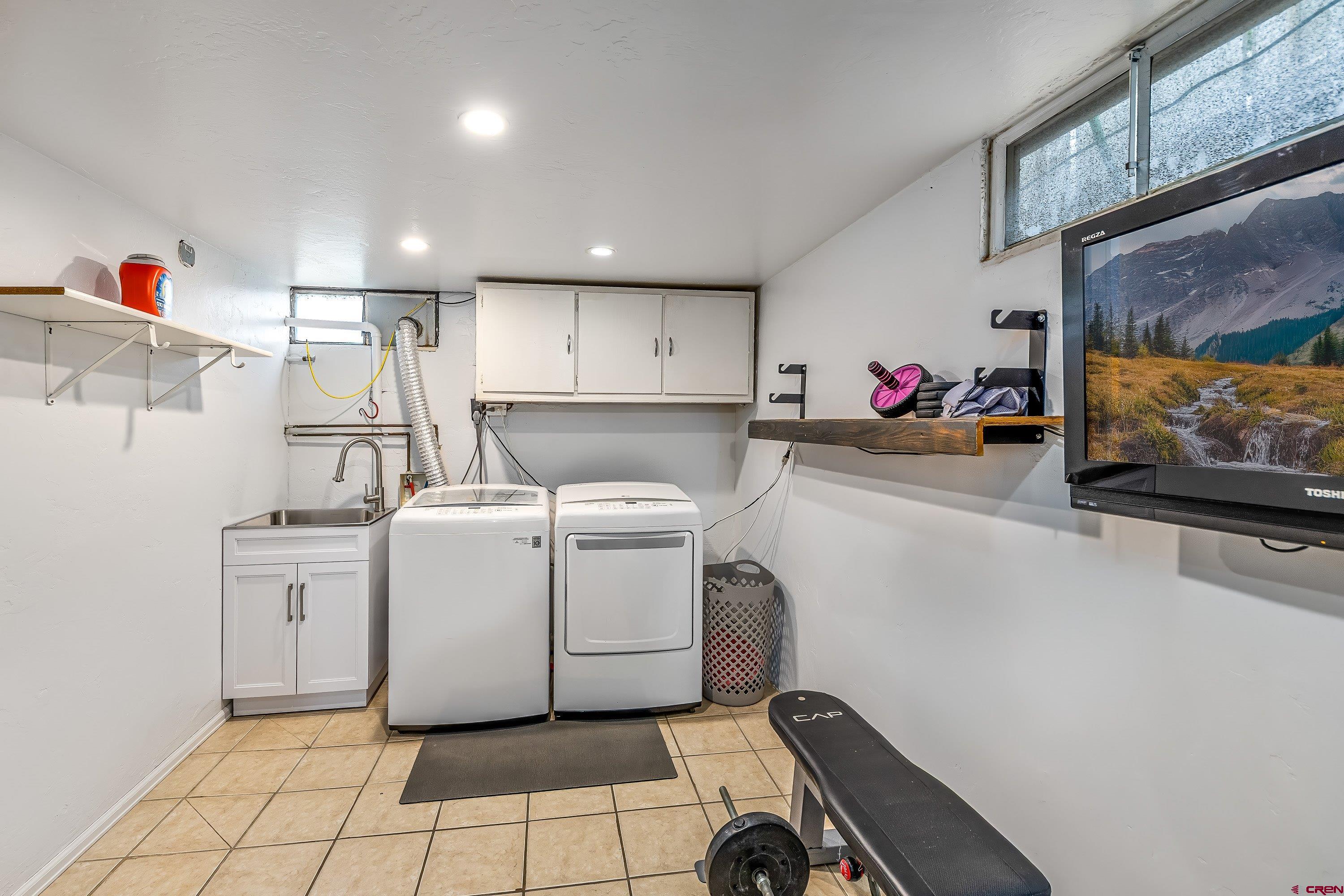 645 Leon Street Delta, CO 81416 - Photo 24 of 28 a utility room with dryer and washer
