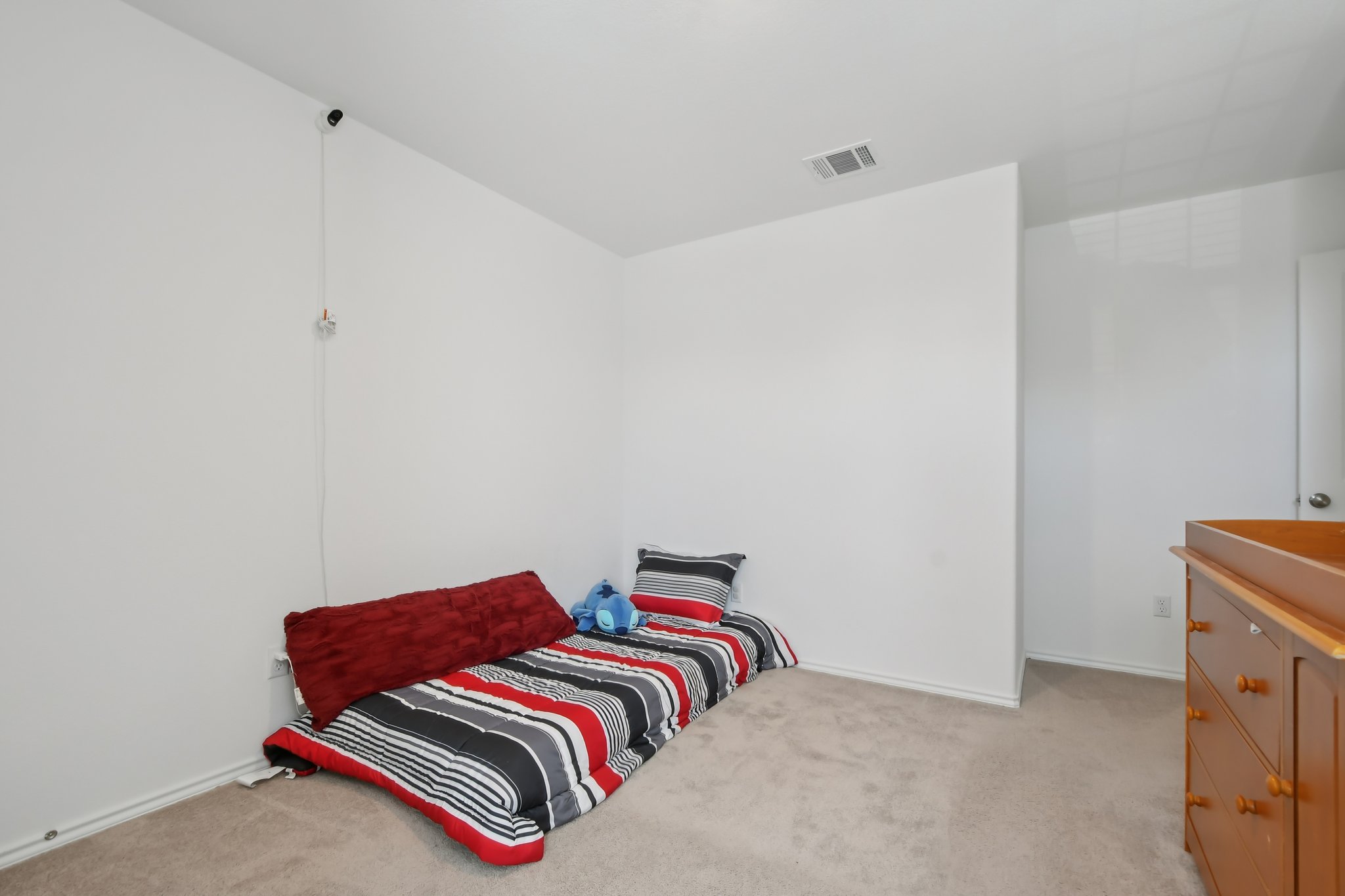 14116 Mussel Run Elgin, TX 78621 - Photo 19 of 40 Bedroom featuring light carpet and baseboards
